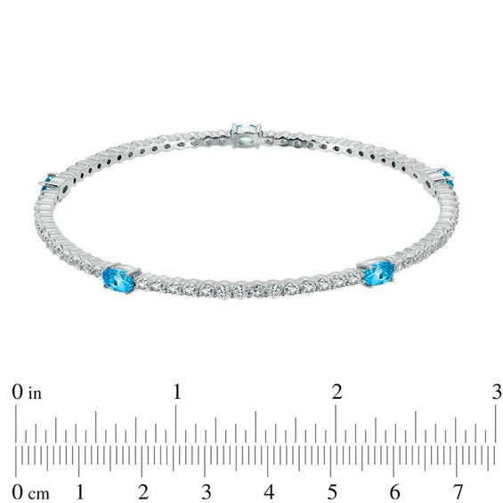 Oval Swiss Blue Topaz and Lab-Created White Sapphire Bangle in Sterling Silver - 8.0"
