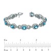 Thumbnail Image 2 of Oval Blue Topaz and Lab-Created White Sapphire Bracelet in Sterling Silver - 7.25"