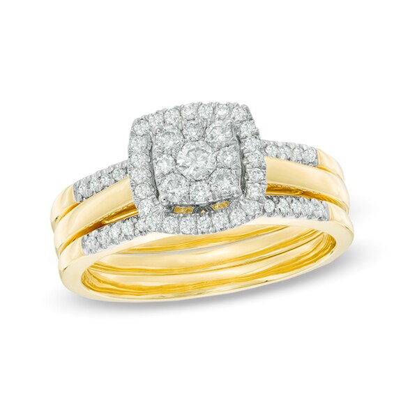 1/2 CT. T.w. Diamond Cluster Frame Three Piece Bridal Set in 10K Gold