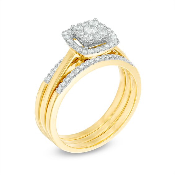 1/2 CT. T.w. Diamond Cluster Frame Three Piece Bridal Set in 10K Gold
