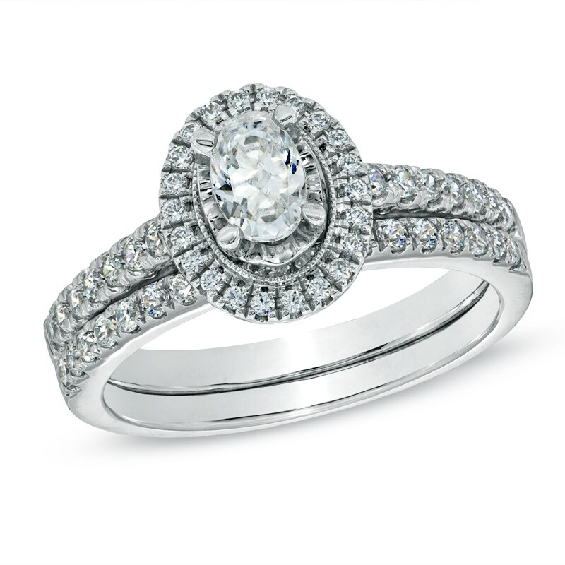 Main Image 1 of Celebration Ideal 1 CT. T.W. Oval Certified Diamond Frame Vintage-Style Bridal Set in 14K White Gold (J/I1)