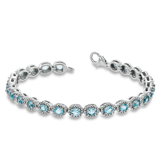 Oval Blue Topaz and 1/20 CT. T.w. Diamond Bracelet in Sterling Silver - 7.5"