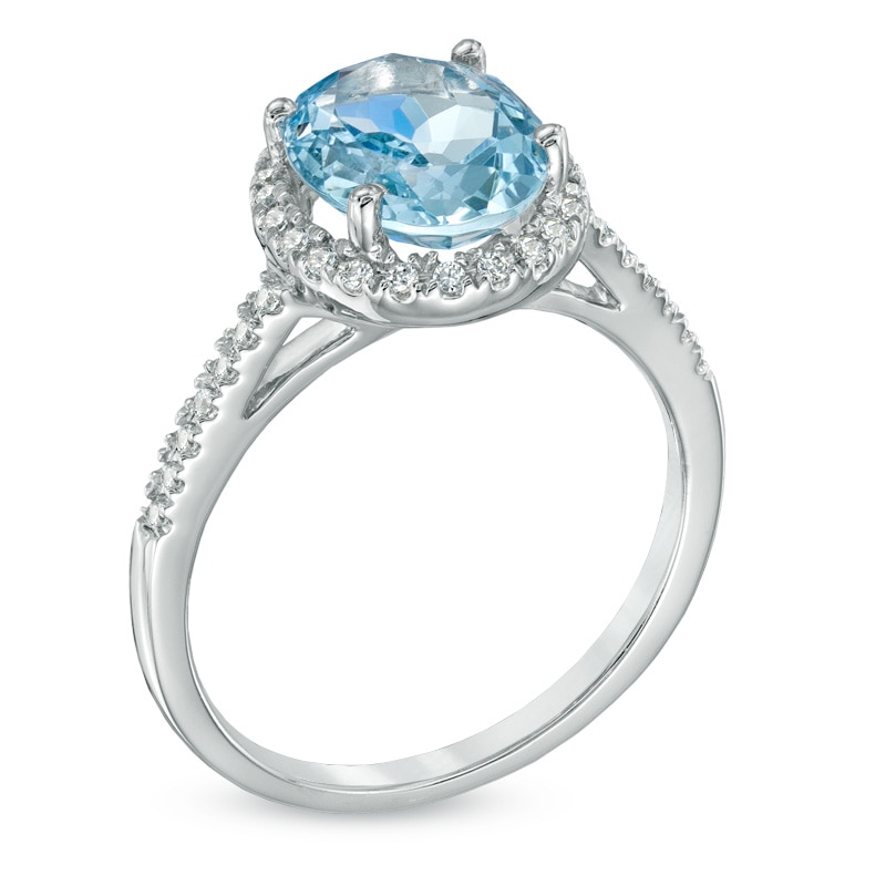 Oval Aquamarine and 1/5 CT. T.W. Diamond Frame Engagement Ring in 10K White Gold