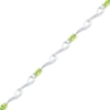 Thumbnail Image 0 of Oval Peridot and Diamond Accent Bracelet in Sterling Silver - 7.5"