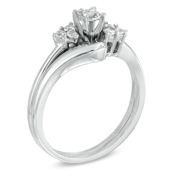 1/6 CT. T.w. Diamond Three Stone Slant Bridal Set in 10K White Gold