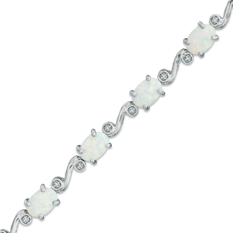 Main Image 1 of Oval Lab-Created Opal and Diamond Accent Bracelet in Sterling Silver - 7.25"