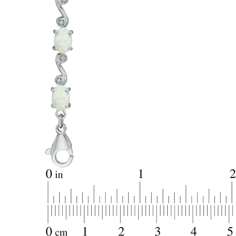 Main Image 2 of Oval Lab-Created Opal and Diamond Accent Bracelet in Sterling Silver - 7.25"