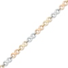 Thumbnail Image 1 of Infinity Link Bracelet in 10K Tri-Tone Gold - 7.25"
