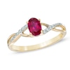 Thumbnail Image 0 of Oval Lab-Created Ruby and Diamond Accent Twist Engagement Ring in 10K Gold