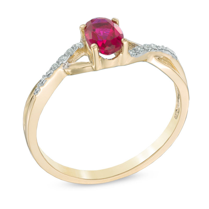 Oval Lab-Created Ruby and Diamond Accent Twist Engagement Ring in 10K Gold