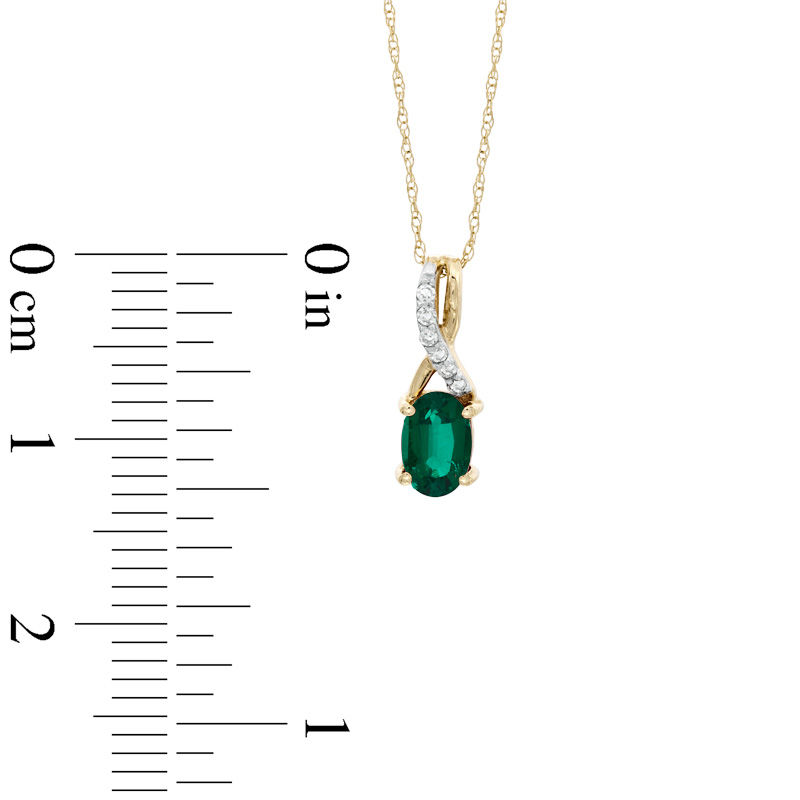 Oval Lab-Created Emerald and Diamond Accent Twist Pendant in 10K Gold