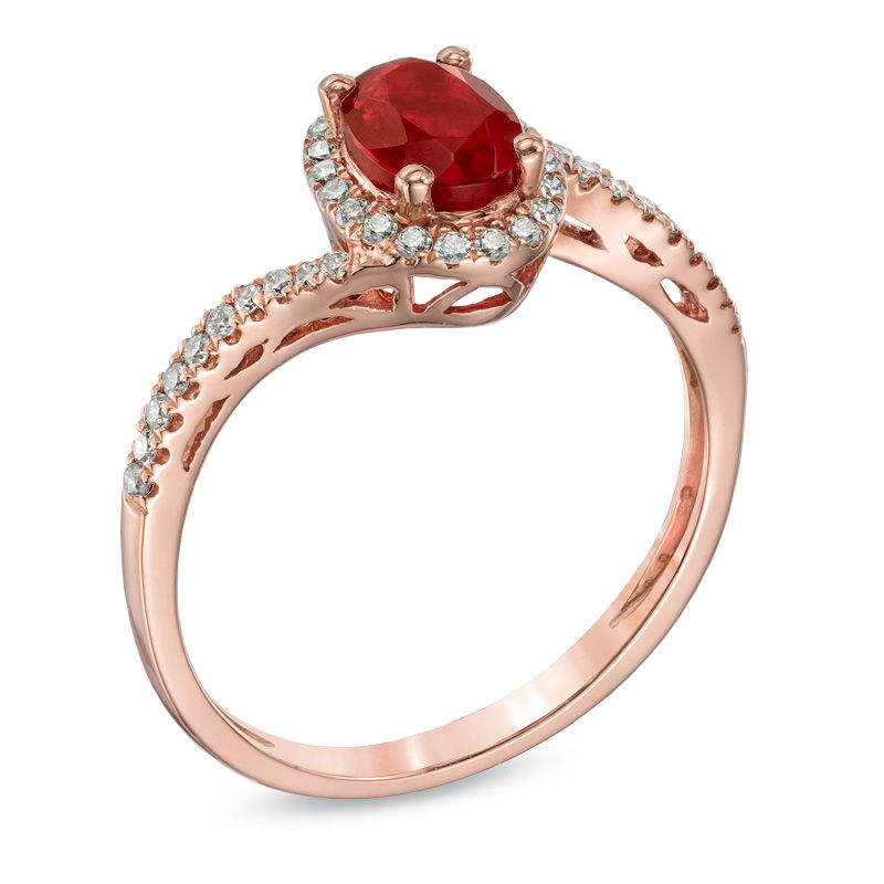 Oval Fire Opal and 1/5 CT. T.W. Diamond Frame Ring in 10K Rose Gold