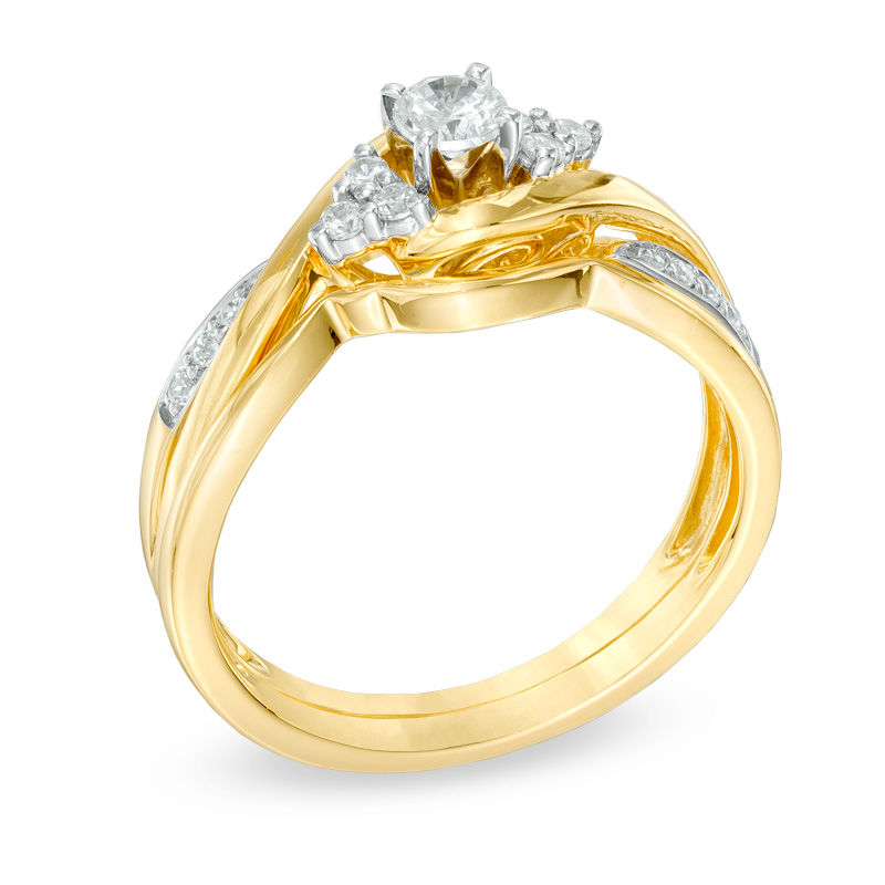Main Image 2 of 1/3 CT. T.W. Diamond Twist Shank Bridal Set in 10K Gold