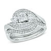 1 CT. T.w. Diamond Three Stone Swirl Bridal Set in 14K White Gold