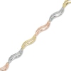 Thumbnail Image 1 of Wavy Link Bracelet in 10K Tri-Tone Gold - 7.25"