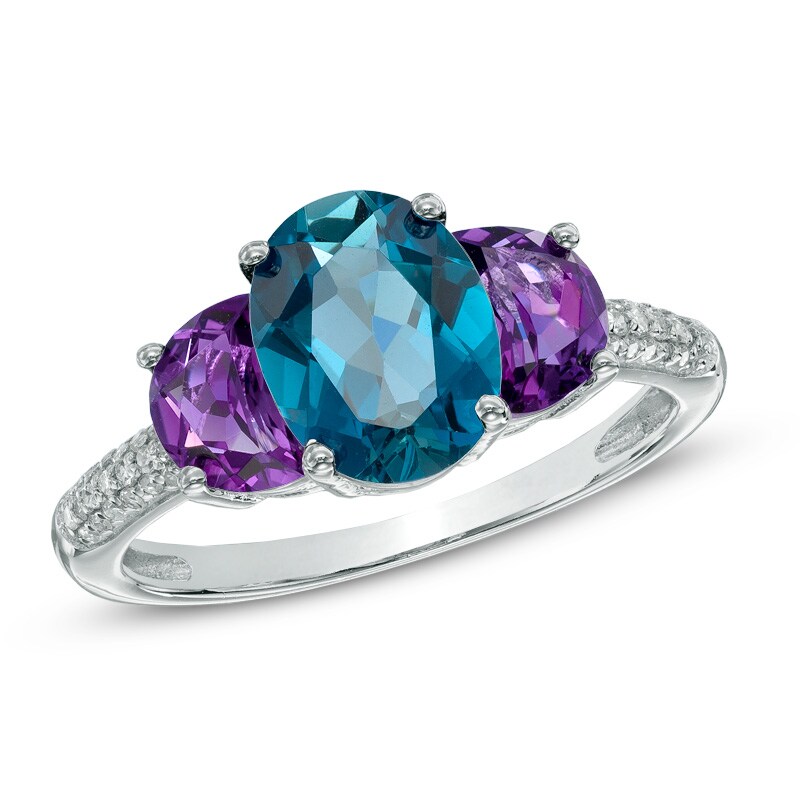 Main Image 1 of Oval London Blue Topaz, Amethyst and 1/10 CT. T.W. Diamond Three Stone Ring in Sterling Silver