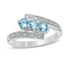 Thumbnail Image 0 of Blue Topaz and Diamond Accent Three Stone Bypass Ring in Sterling Silver