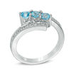 Thumbnail Image 1 of Blue Topaz and Diamond Accent Three Stone Bypass Ring in Sterling Silver