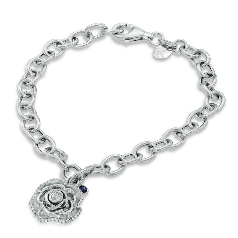 Zales 1/5 Ct. T.W. Diamond Heart Assorted Charm Bracelet in Sterling Silver