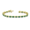 Thumbnail Image 1 of Oval Emerald and 3/8 CT. T.W. Diamond Bracelet in 14K Gold