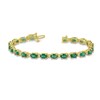 Thumbnail Image 1 of Oval Emerald and 3/8 CT. T.W. Diamond Bracelet in 14K Gold