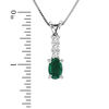 Thumbnail Image 1 of Oval Emerald and 1/10 CT. T.W. Diamond Pendant in 14K White Gold