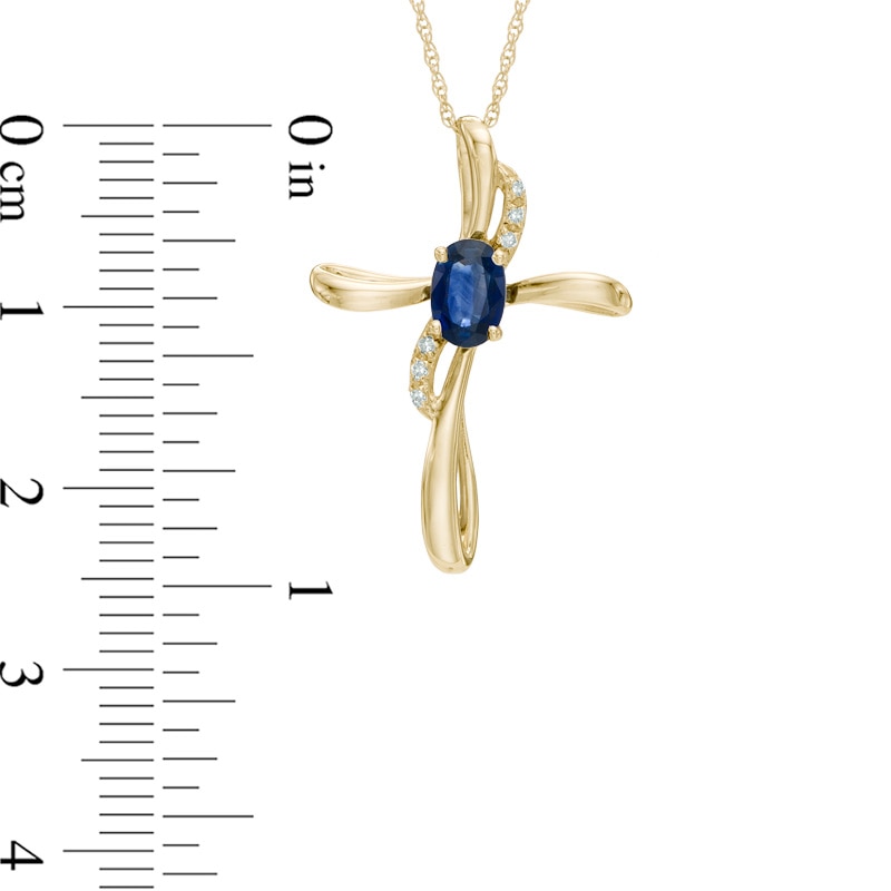 Oval Blue Sapphire and Diamond Accent Cross Pendant in 10K Gold