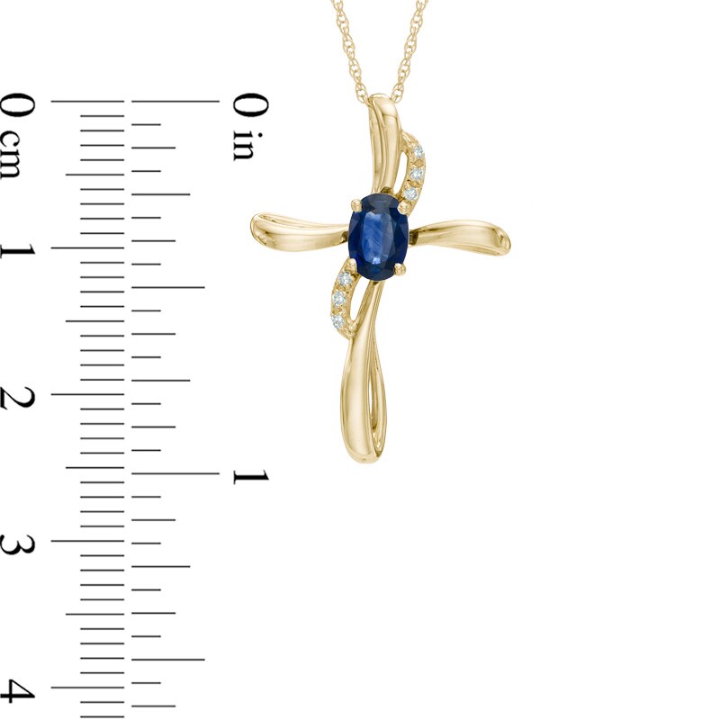 Main Image 2 of Oval Blue Sapphire and Diamond Accent Cross Pendant in 10K Gold