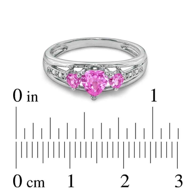 Heart-Shaped Lab-Created Pink Sapphire and Diamond Accent Three Stone Promise Ring in 10K White Gold