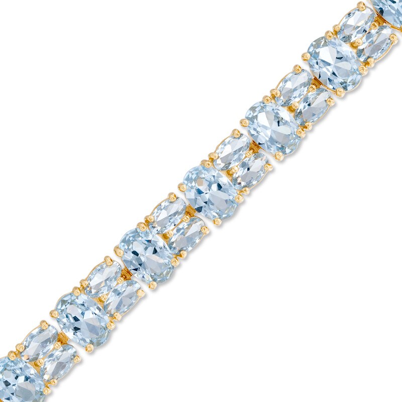 Main Image 1 of Oval Lab-Created Blue Spinel Bracelet in Sterling Silver with 18K Gold Plate - 7.5"