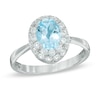 Thumbnail Image 1 of Oval Blue Topaz and Lab-Created White Sapphire Frame Ring in 10K White Gold