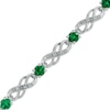 Thumbnail Image 0 of Lab-Created Emerald and 1/20 CT. T.W. Diamond Infinity Bracelet in Sterling Silver - 7.5"