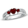 Thumbnail Image 0 of 5.0mm Heart-Shaped Garnet and Diamond Accent Three Stone Promise Ring in 10K White Gold