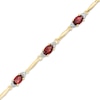 Thumbnail Image 0 of Oval Garnet and Diamond Accent Bracelet in Sterling Silver and 10K Gold Plate - 7.25"