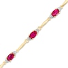 Thumbnail Image 0 of Oval Lab-Created Ruby and Diamond Accent Bracelet in Sterling Silver and 10K Gold Plate - 7.25"
