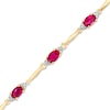 Thumbnail Image 1 of Oval Lab-Created Ruby and Diamond Accent Bracelet in Sterling Silver and 10K Gold Plate - 7.25"