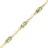 Thumbnail Image 1 of Oval Peridot and Diamond Accent Bracelet in Sterling Silver and 10K Gold Plate - 7.25&quot;