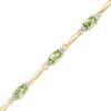 Thumbnail Image 0 of Oval Peridot and Diamond Accent Bracelet in Sterling Silver and 10K Gold Plate - 7.25"