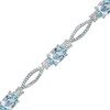 Thumbnail Image 0 of Oval Blue Topaz and Diamond Accent Bracelet in Sterling Silver - 7.25"