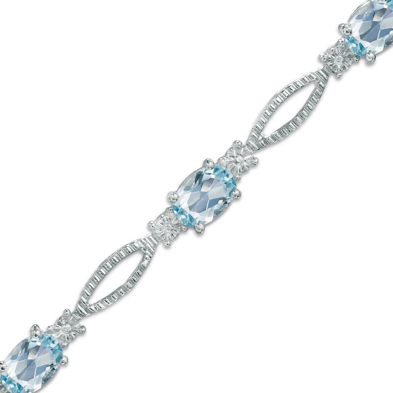 Main Image 1 of Oval Blue Topaz and Diamond Accent Bracelet in Sterling Silver - 7.25&quot;
