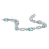 Thumbnail Image 1 of Oval Blue Topaz and Diamond Accent Bracelet in Sterling Silver - 7.25"
