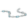 Thumbnail Image 2 of Oval Blue Topaz and Diamond Accent Bracelet in Sterling Silver - 7.25&quot;