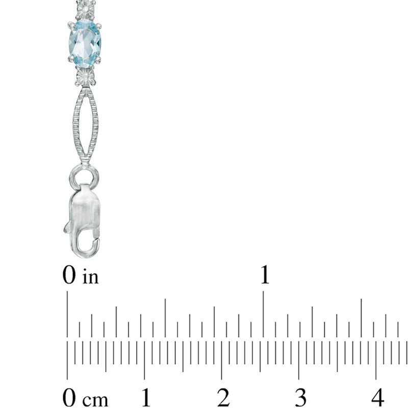 Oval Blue Topaz and Diamond Accent Bracelet in Sterling