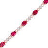 Thumbnail Image 0 of Oval Lab-Created Ruby and Diamond Accent Bracelet in Sterling Silver with 10K Rose Gold Plate - 7.25"