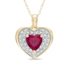 Thumbnail Image 0 of 6.0mm Heart-Shaped Lab-Created Ruby and 1/8 CT. T.W. Diamond Frame Heart Pendant in 10K Gold