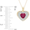 Thumbnail Image 1 of 6.0mm Heart-Shaped Lab-Created Ruby and 1/8 CT. T.W. Diamond Frame Heart Pendant in 10K Gold