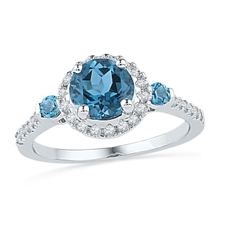 7.0mm Blue Topaz and 1/5 CT. T.W. Diamond Frame Ring in Sterling Silver