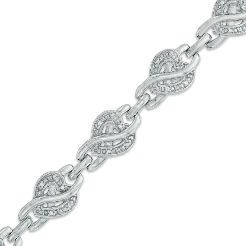 1/10 CT. T.W. Diamond Infinity Overlay Heart Link Bracelet in Sterling Silver - 7.5"