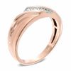 Thumbnail Image 1 of Men's 1/10 CT. T.W. Diamond Three Stone Slant Band in 10K Two-Tone Gold