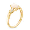 Thumbnail Image 1 of Oval Opal and Diamond Accent Twist Ring in 10K Gold